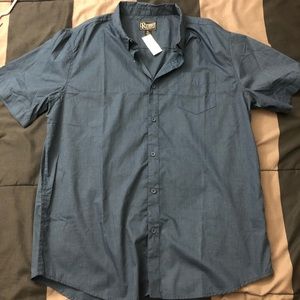 Dark blue button down men’s shirt.